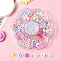 Detailed view of 7-compartment flower-shaped box filled with pastel nail art charms and pearls - Plum Box A00113-Macaron 3D Hearts Stars and Artificial Pearls