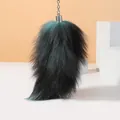 Large fluffy dark fox tail keychain pendant with teal highlights and silver metal chain - Dark Green
