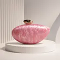 Close-up of pink marble acrylic material and gold bullet clasp on evening clutch - Pink
