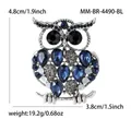 Broche chouette élégante en alliage argenté vintage avec strass bleus et dimensions - Bleu