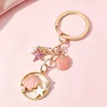 Elegant pink shell and starfish enamel keychain with pearl accents in a golden finish - Pink White Artificial Pearl Starfish Shell (H5110)