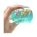 Dettaglio di un gioco antistress a forma di cubetto di ghiaccio con conchiglie marine - Stile Oceano / 4.50cm / Verde