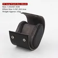 Close-up detail of oval PU leather watch box with removable gray velvet pillow and snap button - Black (Same Color Thread)