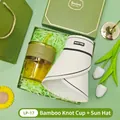 Elegant gift set featuring an amber bamboo glass cup and white sun visor in a green box - Glass Cup + Sun Hat Set (LP-17) / Green