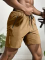 Detailansicht der schnelltrocknenden Herren-Sportshorts mit Reißverschlusstasche - S / Khaki