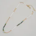 Elegant gold Evil Eye necklace with white cord and natural turquoise stone beads - Enamel Evil Eye Style (MI-N220003F)