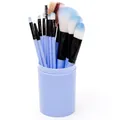 Detail of 12pcs blue makeup brush set stored in a matching cylindrical barrel holder - Blue