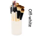 Detail view of 12pcs makeup brush set with soft bristles in a cream cylinder container - Off-white