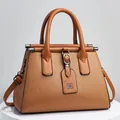 Elegant caramel tan handbag featuring lychee grain leather texture and top handles - 28x14x20cm / Khaki