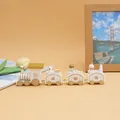 A white and gold wooden Christmas train set featuring bear and snowman figurines - 4-Section 184 White
