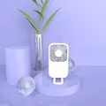 Ventilatore USB bianco portatile su un supporto decorativo viola dal design minimalista - Bianco