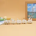 White and gold wooden Christmas train set decoration displayed in cozy home setting - 5-Section 185 White