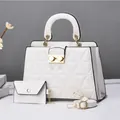 Elegant white quilted handbag set featuring a matching pouch and adjustable strap - White