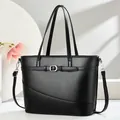 Fashionable black large capacity women's handbag featuring a decorative buckle strap - One Size / Black
