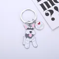 Detailed view of zinc alloy cartoon Schnauzer dog keychain with heart charm tag - Glossy Grey Schnauzer