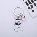 Close-up detail of a cartoon Schnauzer dog keychain featuring an I Heart Dogs charm - Glossy Black Schnauzer