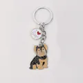 Close-up of a cute Yorkshire Terrier enamel keychain featuring an 'I Love Dogs' charm. - Yorkshire Terrier