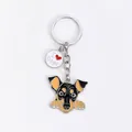 Detailed close-up of a cartoon dog enamel keychain featuring an I Love Dogs round charm. - Rottweiler Head