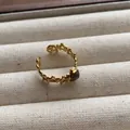 Close-up detail of vintage gold open ring featuring oval grey gemstone on linen background - Pentagram Hollow Oval Gray Gemstone Style (JZ0367) / Adjustable Open Ring (2cm) / Gray