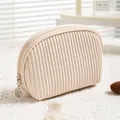 Minimalist cream PU leather travel makeup bag with pleated texture and zipper closure - Half Round Creamy White