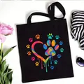 Black canvas tote bag with colorful rainbow paw print heart design for daily shopping - Rainbow Vortex Paw Style (No. 7) / 35x40cm
