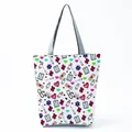 Detailed view of a white tote bag featuring colorful nurse-themed medical pattern prints - White Medical Elements Cartoon Style (hl1516)
