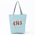 Detailed view of light blue tote bag with cute cartoon nurse print and gray handles. - Light Blue Cartoon Nurse Figure Style (hl1544)
