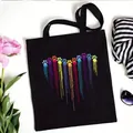 Black canvas tote bag featuring a colorful rainbow heart paw print graphic, 35x40 cm size - Fluid Pendant Rainbow Paw Style (No. 5) / 35x40cm