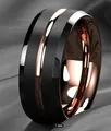 Close-up detail of a matte black stainless steel ring with a rose gold interior - 8mm Rose Gold Beveled Edge