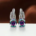 Elegant silver-toned variant earrings featuring oval iridescent stones and CZ accents - Platinum Plated Iridescent