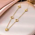Elegante goldene Edelstahl-Halskette mit strukturierten vierblättrigen Kleeblatt-Anhängern - Halskette Aus 648er Gold / 18K Gold