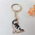 Detailopname van een schattige husky-emaillen metalen sleutelhanger met gouden ring - Husky Stijl 1
