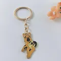 Close-up of a German Shepherd enamel keychain with a gold-colored metal ring. - German Shepherd Style 1