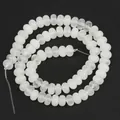 Macro view showing the translucent texture of 5x8mm natural white stone abacus beads - 5x8mm (Approx. 70 Pcs/Strand) / Translucent White