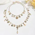 Collana a strati vintage dorata con ciondoli a forma di sole, luna, stella e cuore - Oro (X2962)