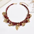 Collana con ciondolo a cuore vintage con cordini intrecciati rossi e tocchi oro - Rosso (X3483)