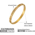 Detailed view of gold 316L stainless steel pig nose bangle with cubic zirconia stones - Gold Bangle (Z267)