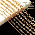 Detailed view of various sizes of light gold titanium steel O-link jewelry chains - 2*3mm / Light gold