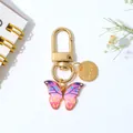 Mooie kleurrijke vlinder hanger sleutelhanger met gouden Love bedel voor tassen - Roze En Blauw Gradiëntstijl (A)