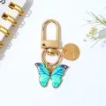 Colorful enamel butterfly keychain with gold Love charm for bags and earphone cases - Blue Green Gradient Style (E)