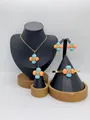 Macro detail of high-quality stainless steel jewelry set featuring colorful floral bead charms - Light Blue Coral Orange Four-Petal Style (LX030010 Blue Orange)