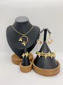 Elegant gold stainless steel jewelry set featuring intricate butterfly design details. - Butterfly Hollow Mesh Style (LX010050)