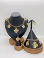 Elegant gold stainless steel jewelry set featuring hollow four-leaf clover design - Hollow Spiral Texture Floral Style (LX010037)