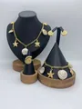 Golden stainless steel ocean themed jewelry set featuring shell and starfish charms - Shell Starfish Sea Turtle Style (LX010040)
