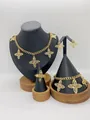 Elegant gold stainless steel jewelry set featuring fingerprint clover motif pendants - Streamlined Texture Clover Style (LX010035)
