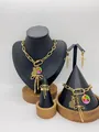 Gold stainless steel jewelry set with pineapple and bow charms on display stands. - Pineapple Bow Rainbow Enamel Style (LX010046)