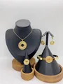Gold stainless steel jewelry set featuring wave patterned necklace earrings ring and bracelet - Abstract Ring Ripple Style (LX010029)