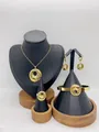 Elegant gold stainless steel jewelry set featuring textured circular pendant design for women - Radial Texture Hollow Pendant Style (LX010028)