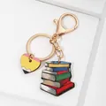 Teacher-themed acrylic keychain with pencil heart and stack of books on white background - Heart and Books Style (1) / 5cm