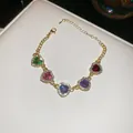 Fashionable gold-toned chain bracelet with five multi-colored heart-shaped crystals - Bracelet (Gold-Multicolor)